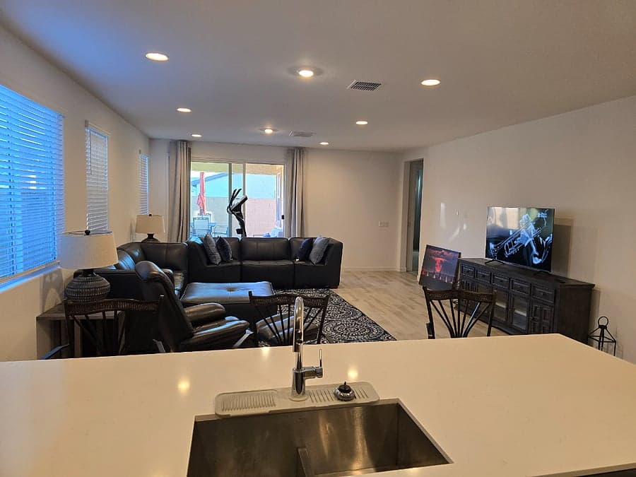 Great room with sectional sofa seen from the kitchen island