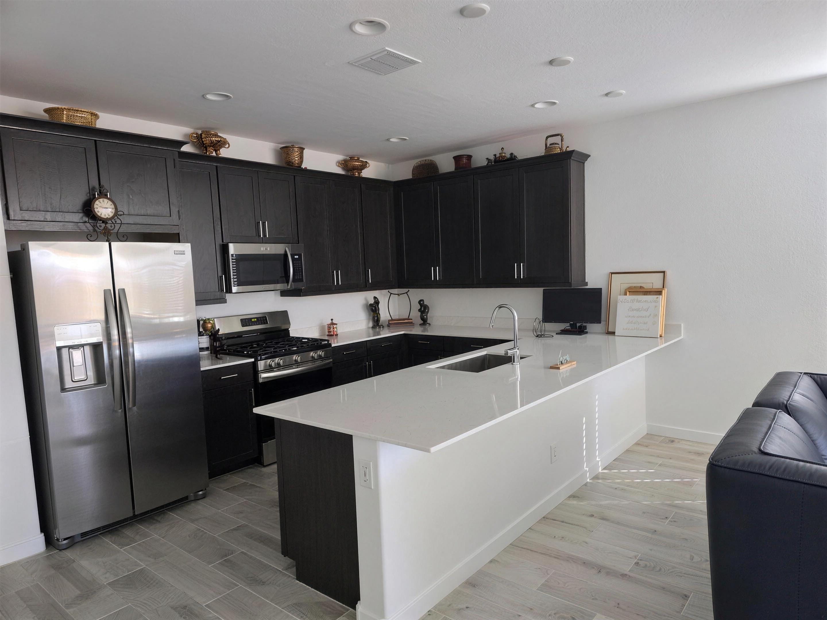 Chef's kitchen with quartz island at The Greenwood